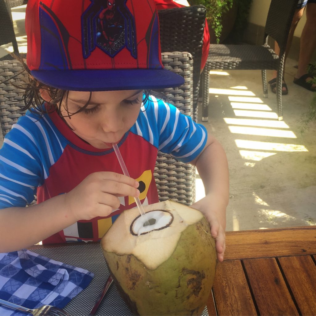 drinking a coconut in negril