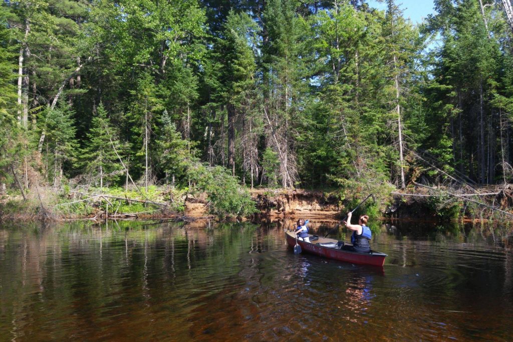 mom and son canoeing on bonnechere river