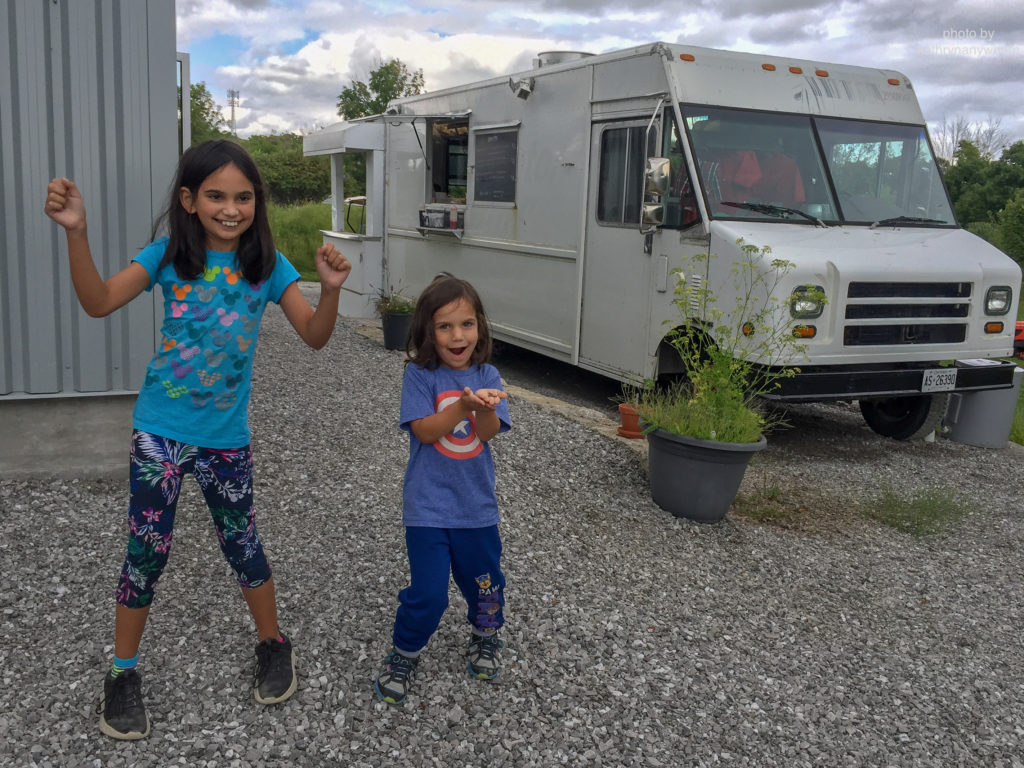 Luxury Family Glamping Ontario, kids dancing outside food truck