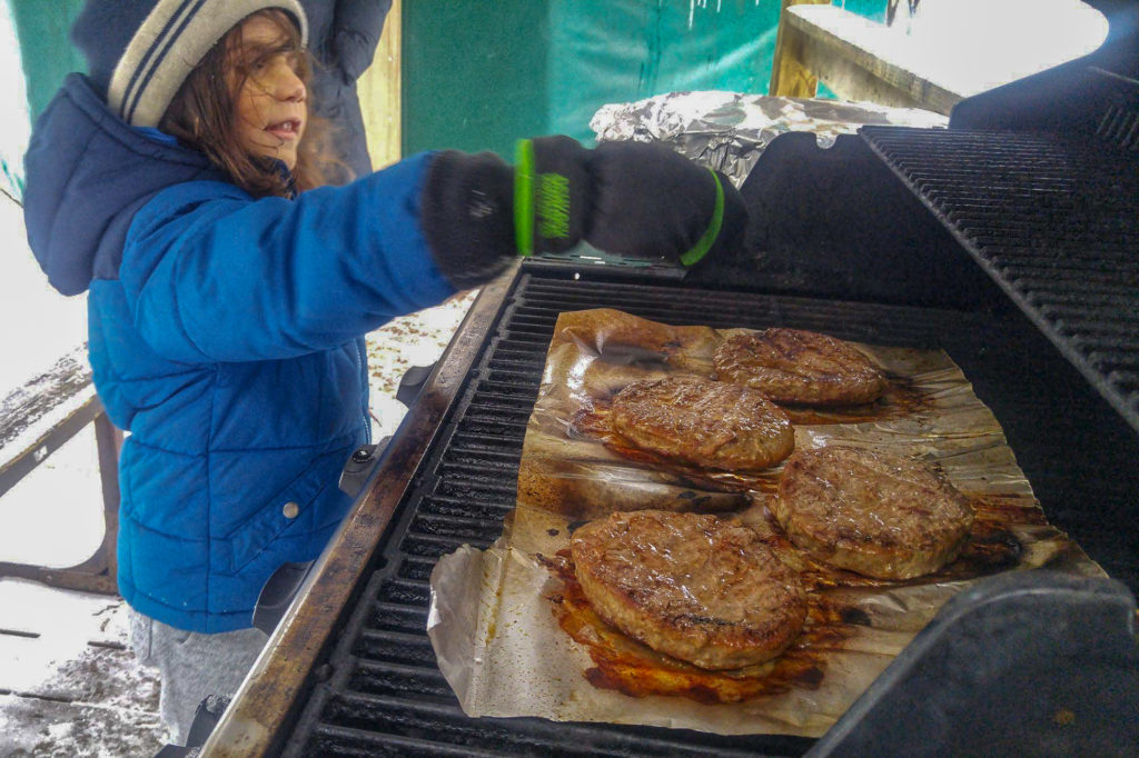 Cooking while winter camping at MacGregor Point Provincial Park in February! We BBQ's burgers one day! #findyourselfhere #macgregorpointprovincialpark #macgregorpoint #macgregorpp #ontarioparks #yurtcamping #wintercamping #outdoors #adventureparenting #portelgin #brucepeninsula #campcooking PHOTO BY BRIAN TAO LUXOGRAPHY