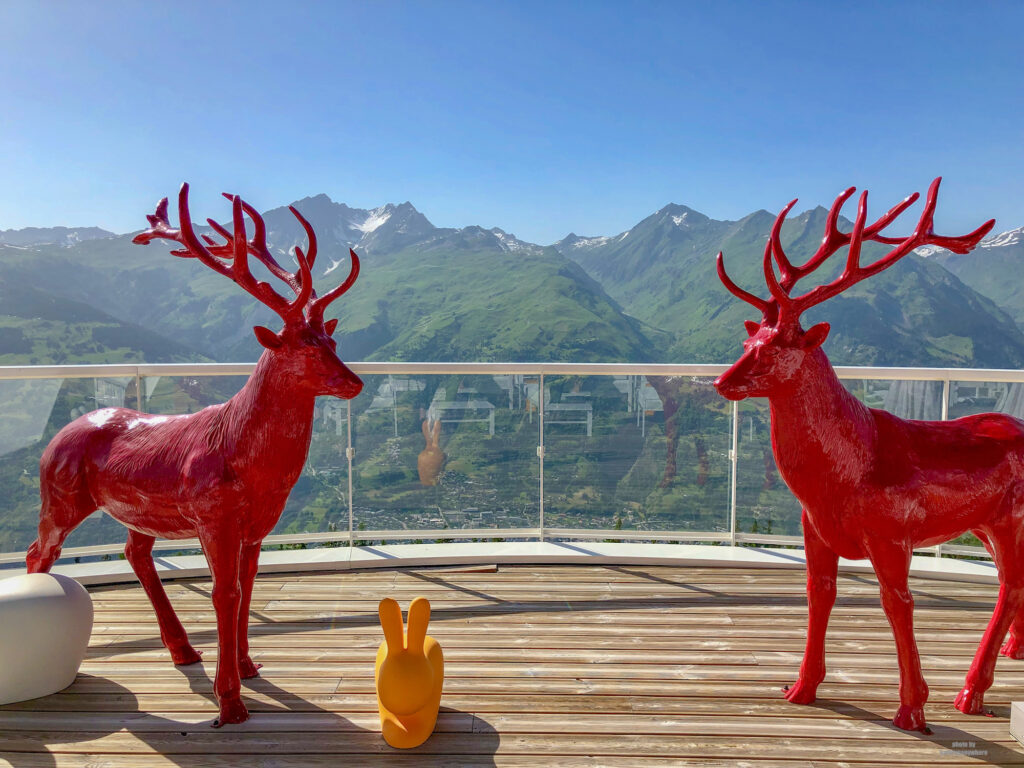 The iconic red caribou on the terrace at the Belevedre Collection at Club Med Les Arcs Panorama