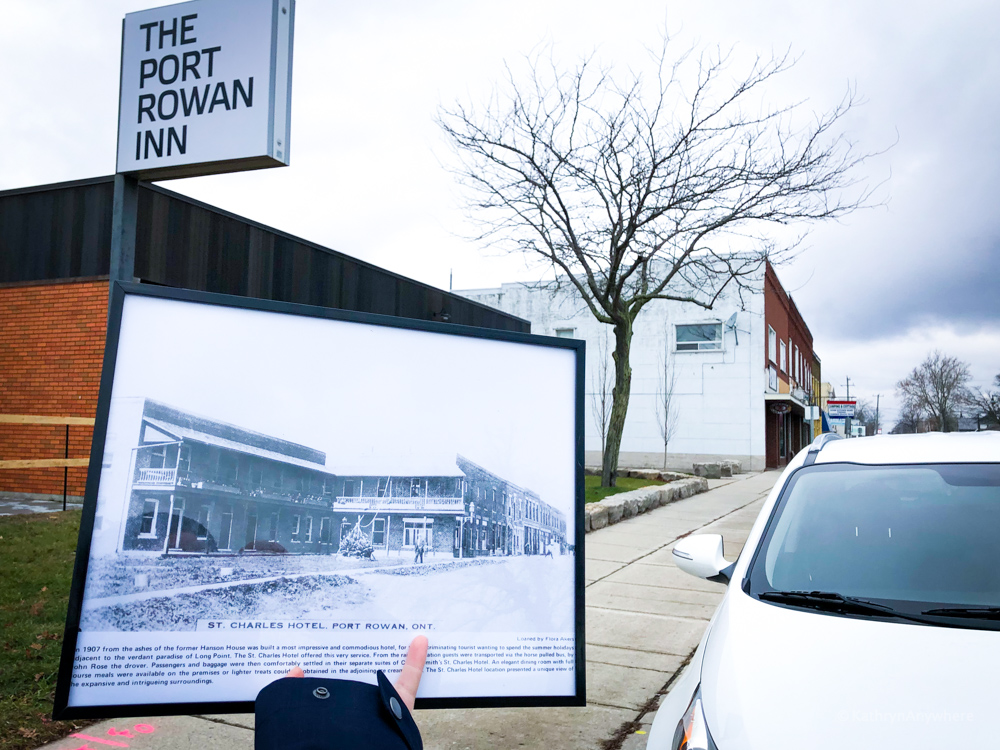 Exterior of Port Rowan inn with historical photo in front of it marking the history of the block