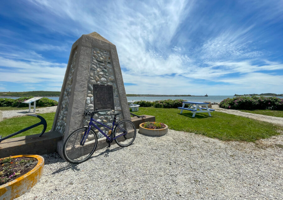 Fish Point Memorial Yarmouth, Nova Scotia with bike in front of the monument to the lost at sea