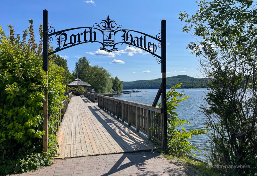 North Hatley sign beside lake in front of a walkway