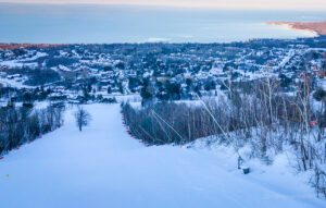 Craigleith Ski Club hill from the top looking down with snow making blowers on the right