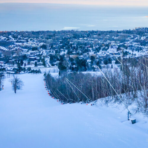 Craigleith Ski Club hill from the top looking down with snow making blowers on the right