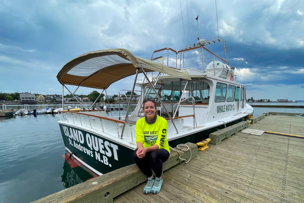 Senior marine biologist Nicole Leavitt with Island Quest Marine poses in front of a whale watching boat in St. Andrews, N.B.